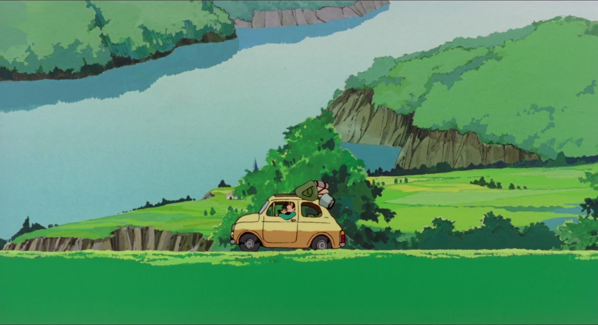 A yellow buggy driving along a green landscape, a wide river in the background